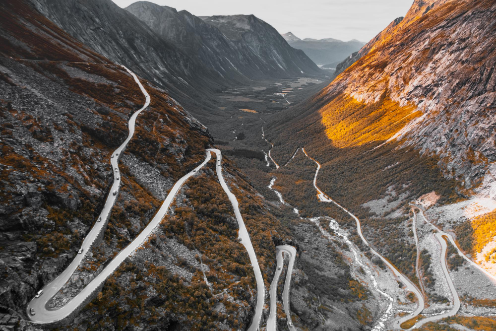 Steep mountain pass twists and hairpin curves at Babusar Top road requiring engine braking safety methods